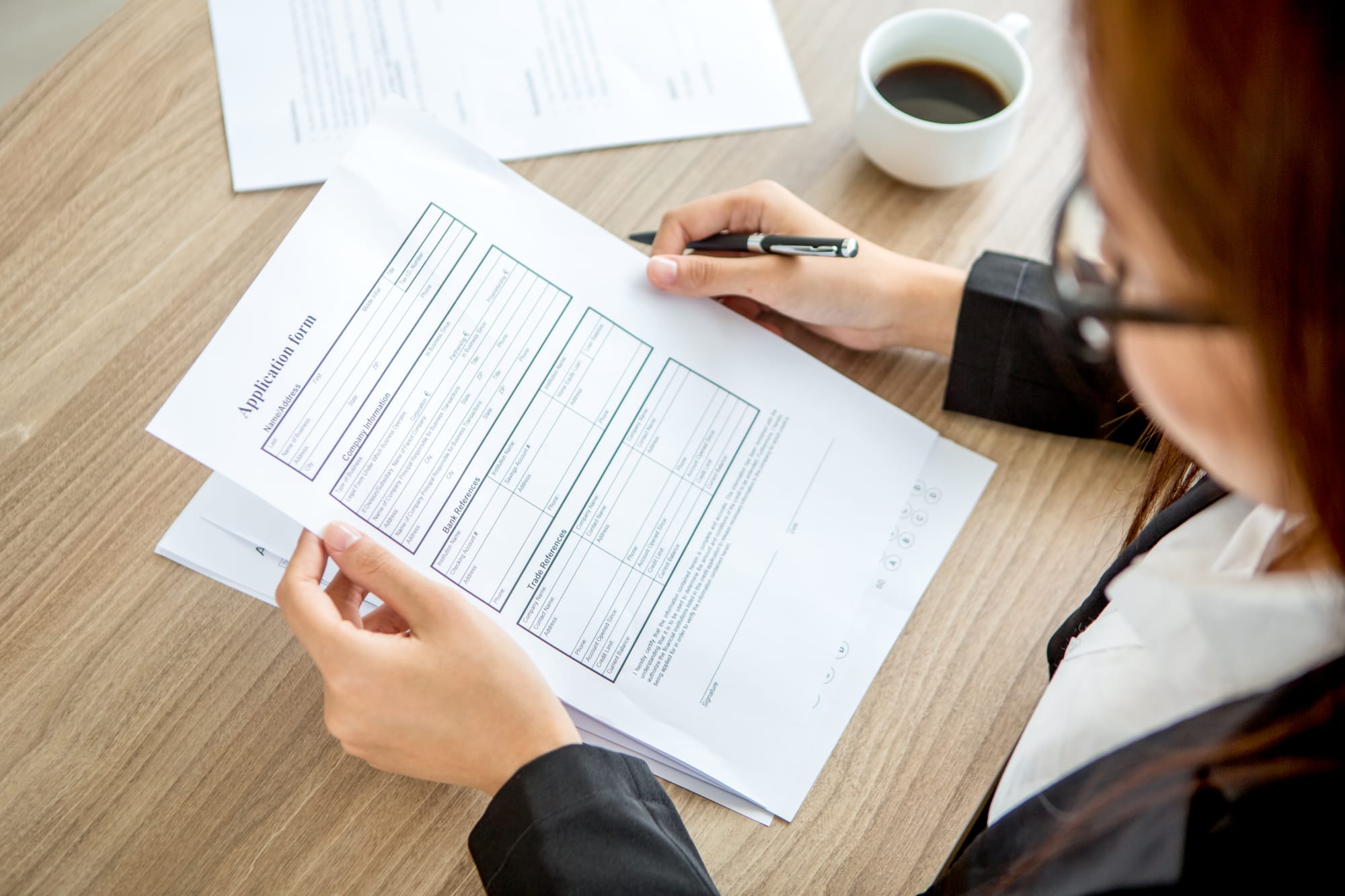 woman reading medical form information