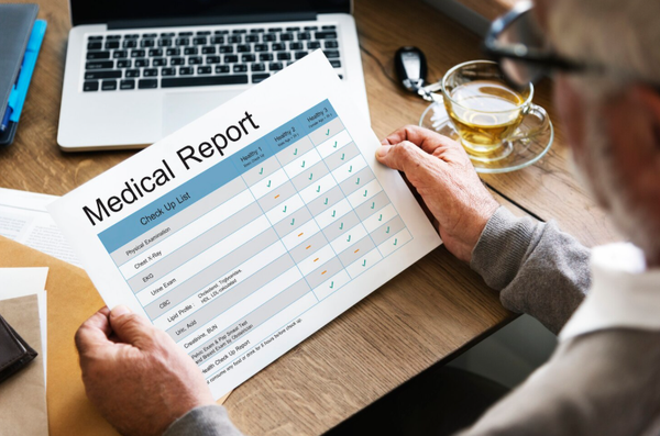 man looking at health records