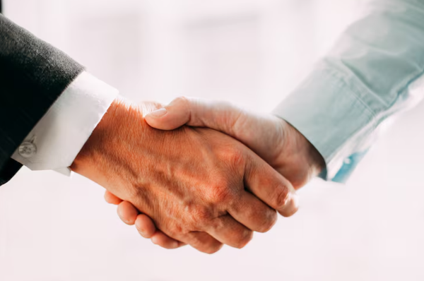 shaking hands veterinary partner